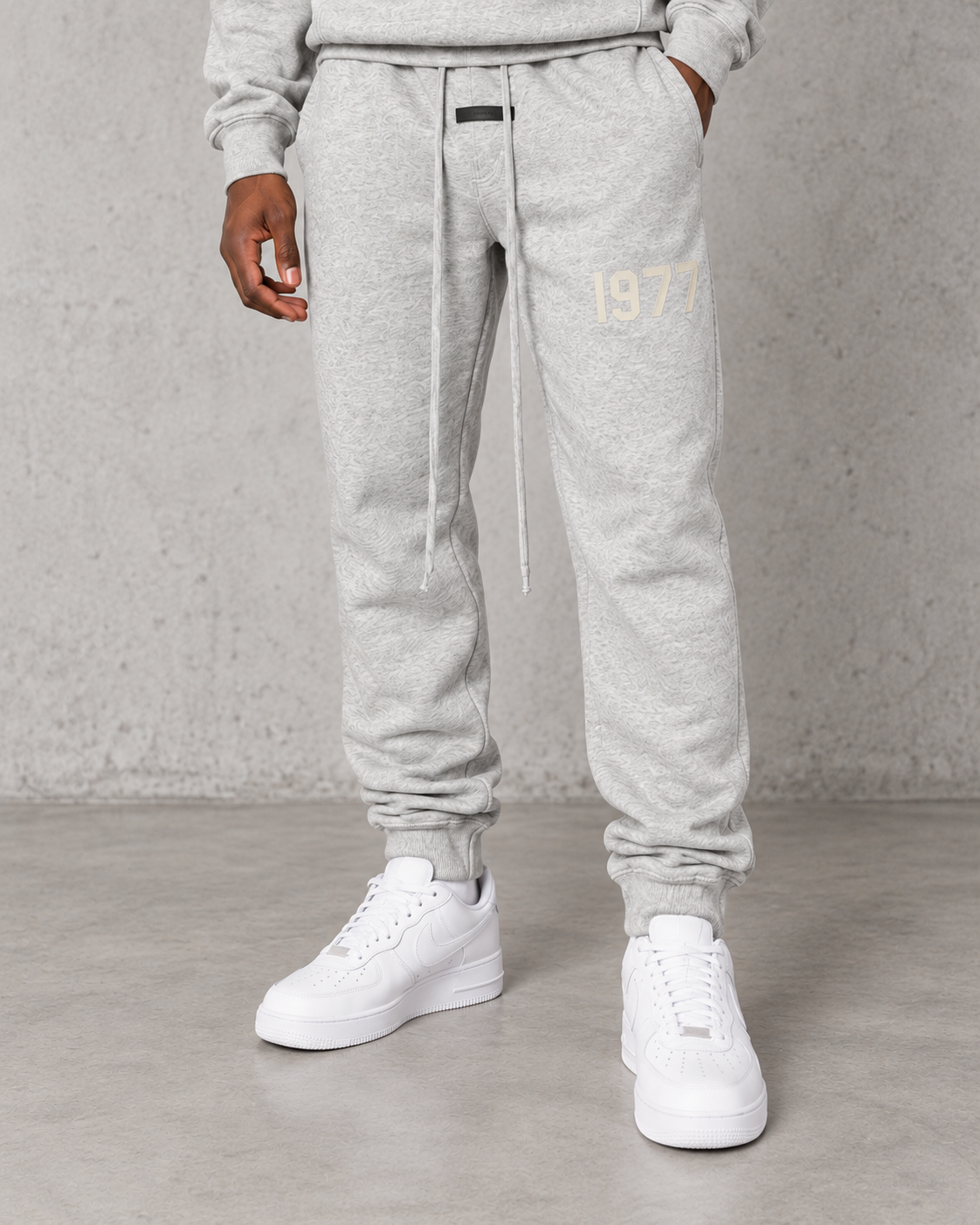 Fear of God Essentials 1977 cuffed joggers in light oats, sold separately