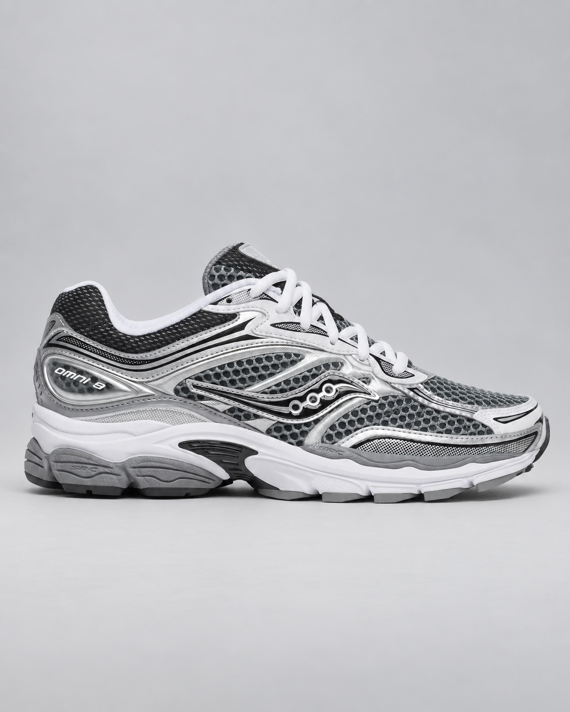 Saucony ProGrid Omni 9 Grey/Silver, lateral view on a light grey studio background