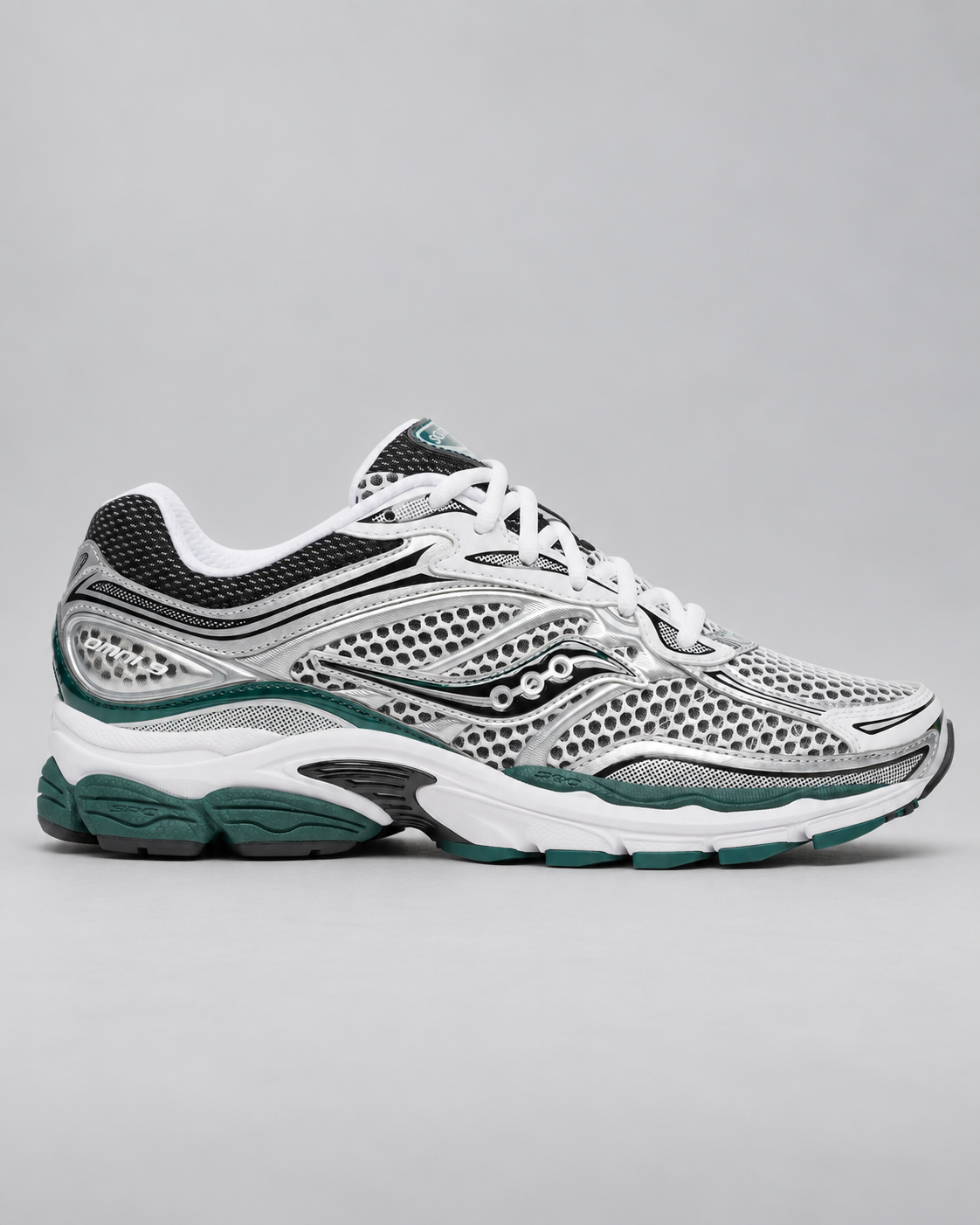 Saucony ProGrid Omni 9 White/Pine Green, lateral view on a light grey studio background