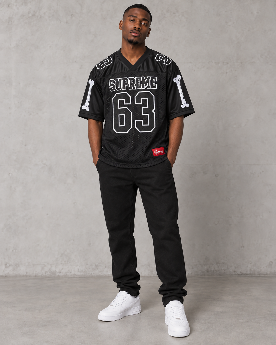 Model wearing the Supreme Bones 63 black football jersey