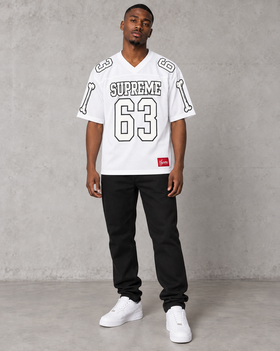 Model wearing the Supreme Bones 63 white football jersey